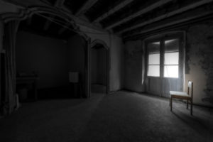 interior of an empty room with a chair and in a general state of abandonment in the city center of Barcelona in Catalonia Spain interior of an empty room with a chair and in a general state of abandonment in the city center of Barcelona in Catalonia Spain